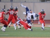 Orange coast college pirate, Robert Murtha #34 is sent flying after being hit by Palomar comets strong safety #47 Stephen Parks. On Chick Embrey field at escondido high school, on Saturday September 28 2013. Image taken at Escondido HS. Escondido Ca. Image taken by Paul Anthony Francis Jr / Telescope