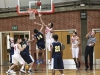 Palomar forward Jeremy Franklin (23) battles Franky Rizzo (14) of Bethesda University for a rebound during the 9th Annual Palomar College Thanksgiving Tournament on Nov. 29 in The Dome. Comets won 76 – 70 and will play Southwestern on Nov. 30 in a semi-final game. • Stephen Davis/Telescope