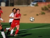 Midfielder Kaitlyn Crone (#10) charges toward the ball in a women's soccer game against Imperial Valley College at Minkhoff Field. Kaitlyn finished the game with one goal in The Comets' impressive 4-0 win against The Arabs. • Scott Colson/Telescope