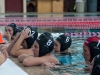 Palomar women's water polo team listen to their coach during the game against Grossmont on Oct. 9 in the Wallace Memorial pool. • Xenia Spatacean/Telescope