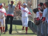 Palomarâs head softball coach Lacey Craft congratulates shortstop Kali Pugh (left) and outfielder Keilani âKKâ Fronda (right) after scoring on designated hitter Carlie Danielâs RBI double against Riverside City College on April 15 at Palomarâs softball field. Fronda and Pugh both went 3-4 in the Cometsâ 9-4 win over the Tigers in a rematch of the 2013 state title game when Palomar brought home a championship with a 7-2 win. Scott Colson/The Telescope