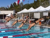 Members of the Palomar College and Grossmont College men's swim team dive into the pool to begin the 1000 yard freestyle event consisting of 40 lengths of the pool March 14, 2014. Lucas Spenser/Telescope 2014.