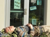 Telescope staff member Belen Ladd relaxes before class outside of the newsroom.