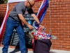 November 8, 2013 | President of the Palomar College Student Veterans Organization; Master Gunnery Sgt. Andres Garcia, United States Marine Corps (Retired); lays a rose at the Palomar College Veterans Memorial. The roses were placed at the Memorial as the College's Bell Tower rang for each name on the memorial. /PHOTO CREDIT: Stephen Davis/Copyright 2013 The Telescope