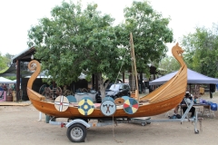 A Viking-style boat shaped like a dragon and adorned with painted shields sits near the entrance to the Vista Viking Festival on Sept.21, 2025. Photo credit: Tanner Hayes
