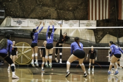Palomar College's Teiora Tinoisamoa (#6) is spiking the ball past San Bernardino Valley College's Cielo Rodriguez (#21) and Ashlee Zimmer (#21) in the second set on Sept 10, 2025, at The Dome.