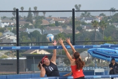 Annie Cummings (#7) jumps to block an oncoming ball during a match against San Diego City on March 27 at MiraCosta college. 