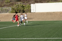 Hailey Perez (#17) kicks the ball for a goal in the second half, as Haolani Veana (#25) and Brianna Gamon (#2) from the East LA Huskies try to recover it. Photo credit: Griselda Garcia