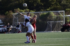 Midfeilder, Naomi Allen (#24), tries to get the ball from East LA Huskies Sandy Padron (#22), while Padron is in the air and Jacky Gallardo (#32) assists. Photo credit: Griselda Garcia
