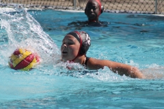 Malia Hanss (#12) retrieves the ball after blocking a pass from a Cerritos College player. Hanss scored four points for Palomar during the first game of the mini tournament. Hanss scored four goals in both games. Photo credit: Griselda Garcia
