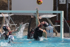 From left to right: Kaylin Mihelich (#6), Savannah Walker (#1), and Malia Hanss (#12) block a goal attempt from a Cerritos College player on Sept,5,2025, at Palomar College. Mihelich and Hanss tied for most goals scored. Photo credit: Griselda Garcia