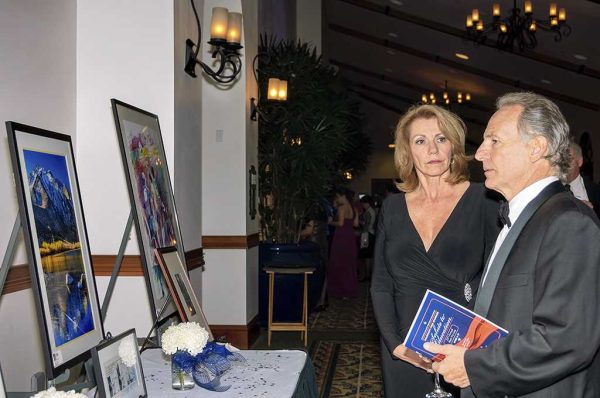 Nov. 16, 2013 | Michele and Eric Davey (l-r), guests at Palomar's Salute to Education that was held at La Costa Resort and Spa, Carlsbad, Calif., look at the art that was on auction to raise money for Palomar College students and programs. (Francois Swart/The Telescope)