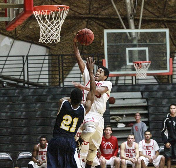 The 9th Annual Palomar Thanksgiving Tournament has held during last semester's Thanksgiving Break at The Dome. In Palomar's first game Guard Braxton Smith (10) scores two points and is fouled by Bethesda’s Mike Walker on this layout during the second half of the game. The Comets won the game 76 – 70 and advanced to a semi-final matchup against Southwestern. (Stephen Davis/The Telescope)