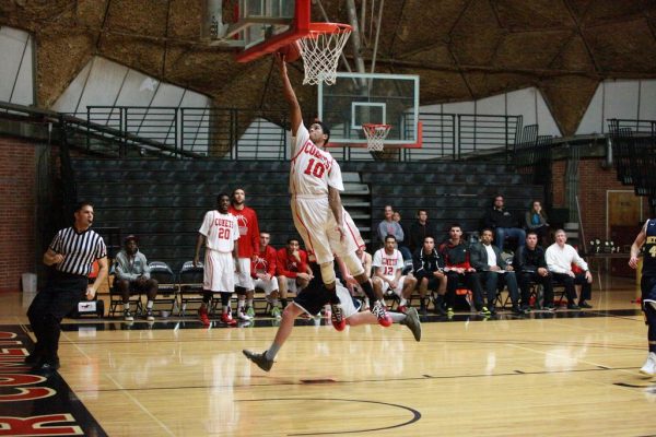 Nov. 29, 2013 | Palomar Guard Braxton Smith (10) glides in for a layup in the final minutes of Friday’s game against Bethesda University. Smith finished with ten points in the Comet's win in the 9th Annual Palomar College Thanksgiving Tournament. (Stephen Davis/The Telescope)