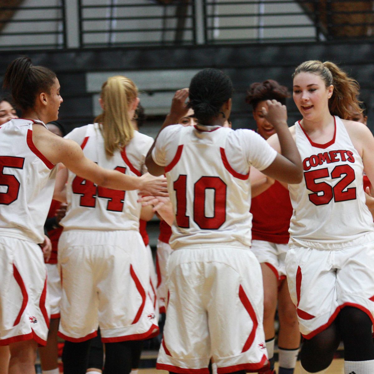 Jan. 24, 2014 San Marcos, Calif. l Forward Jessica Scott (#52) greets her team mates during player introductions before Palomar women’s basketball’s game against Mira Costa College in The Dome. The Comets beat the Spartans 78-50 and it was their 7th win in their last 8 games. (Scott Colson/The Telescope)