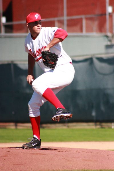 Starting pitcher Zach Wilkins (#25) throws a pitch to his opponent from Golden West College at Palomar’s home opener on Feb. 1, 2014 at Myer’s Field. Wilkins, a University of Nevada signee, pitched 7 innings only allowing 1 run in the Comets’ heartbreaking 2-1 14 inning loss to the Rustlers. (Scott Colson/The Telescope)