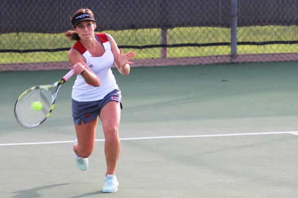 Palomar women's tennis player Teresa de Anda hits a forehand against Irvine Valley College on Feb 11 at Palomar's tennis courts. (Joe Davis/The Telescope)