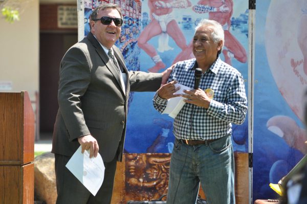 Palomar College President Robert Deegan recieves recgnition from Chicano Studies Professor John Valdez during the Civil Rights Festival held in the Student Union Quad Wednesday, April 16, 2014. President Deegan was regognized for his support of the multicultural department. (Monica Dattage/The Telescope)
