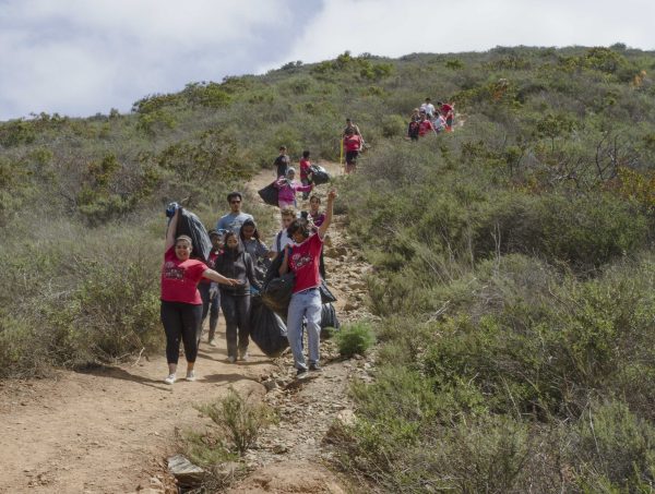 Volunteers trek down the hill following the clean-up and re-powdering of the Palomar “P” on April 25, 2014. (Steve Porter/The Telescope)