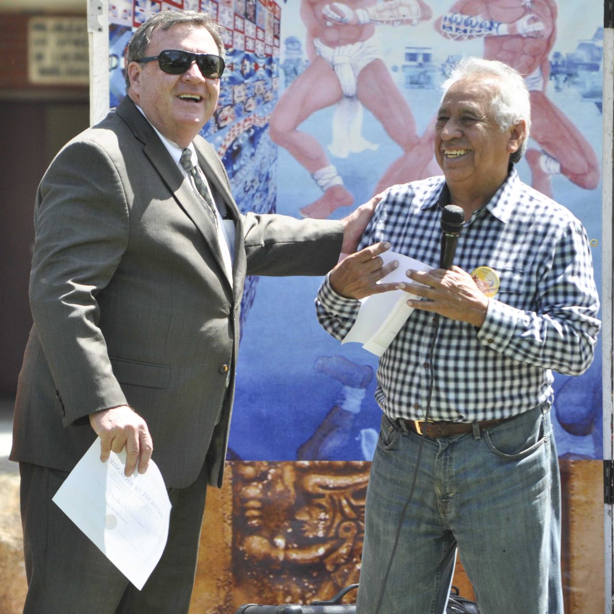 Palomar College President Robert Deegan recieves recgnition from Chicano Studies Professor John Valdez during the Civil Rights Festival held in the Student Union Quad Wednesday, April 16, 2014. President Deegan was regognized for his support of the multicultural department. (Monica Dattage/The Telescope)