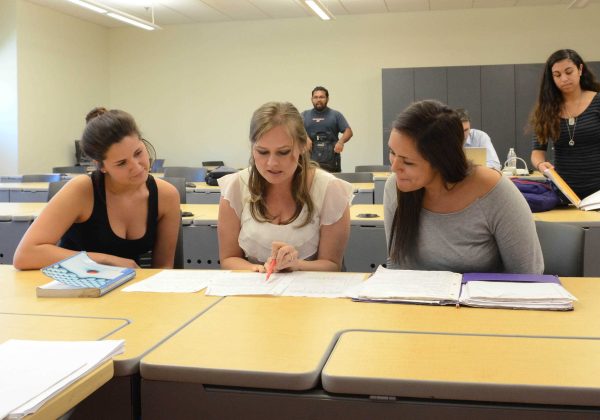 Michelle Vogel-Trautt Psychology Faculty Instructor Award discusses class assignment with student Jessica Holden (r) and Chloe Dolkan (l) before class on April 24, 2014 at Palomar College San Marcos Campus. (Lucy Wheeler/The Telescope)