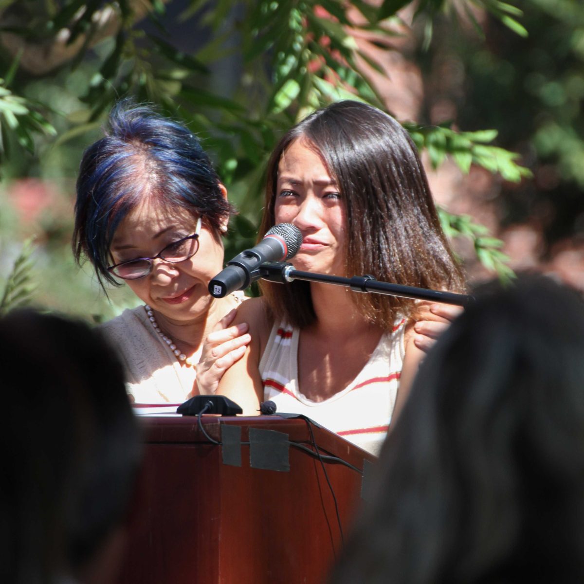 Palomar International Student Program Coordinator, Yasue O’Neill comforts Palomar international student Akari Hasegawa a friend of victim as she speaks at the Celebration of Life ceremony at Palomar Sept. 19, 2014. (Yoshikazu Yamashita/The Telescope)