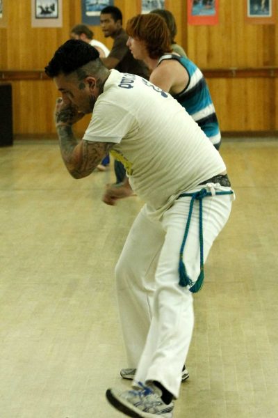 Palomar student Pablo Salgado warms up at the beginning of Elias Fonseca's Capoeira class on Sept. 16, 2014. (Angela Marie Samora/The Telescope)