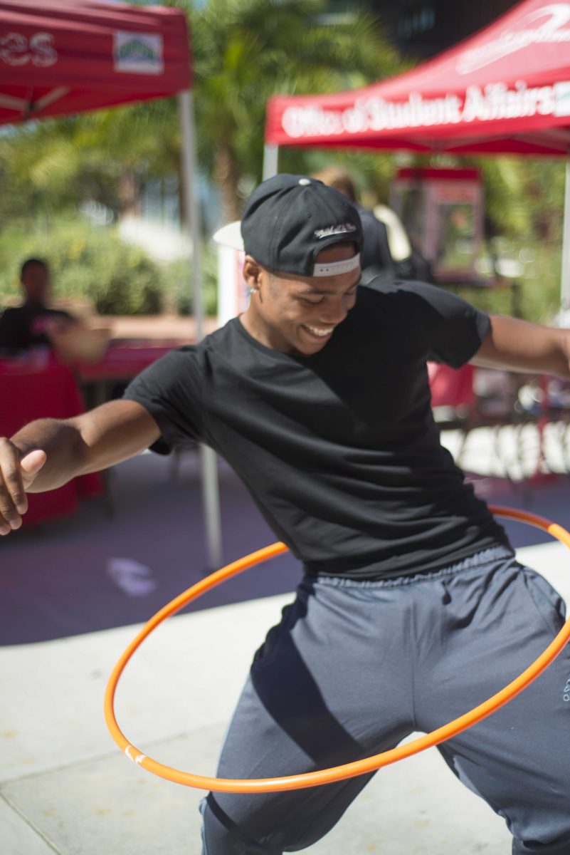 Sophomore MJ Bailey ,20, hula hoops during the Comet Celebration in the quad at Palomar College on Oct. 22, 2014. The Comet Celebration is a two-day event hosted by the Associated Student Government (ASG). (Casey Cousins/The Telescope)