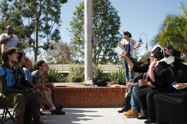 Students pair up and compete in the marshmallow toss at Halloween Escape, Oct. 30, 2014. (Angela Marie Samora/The Telescope)