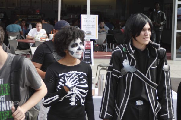 Gabriella Pleasant and Stephen Lopez await the results during the first round of the costume contest at Halloween Escape, Oct. 30, 2014. (Angela Marie Samora/The Telescope)