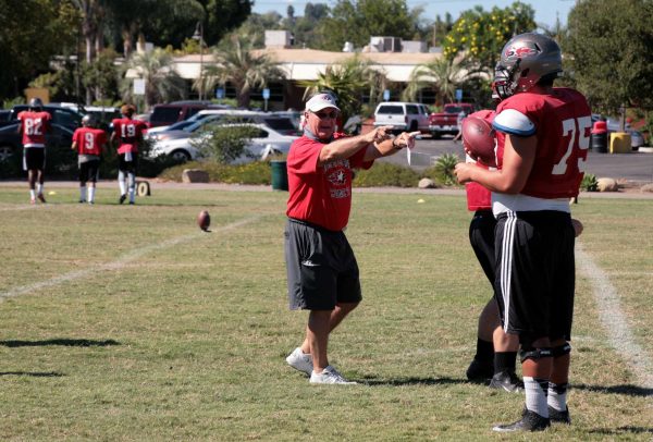 Quarterback Coach Bill Diedrick points to a Palomar player with both hands and speaks. (Telescope Staff/The Telescope)