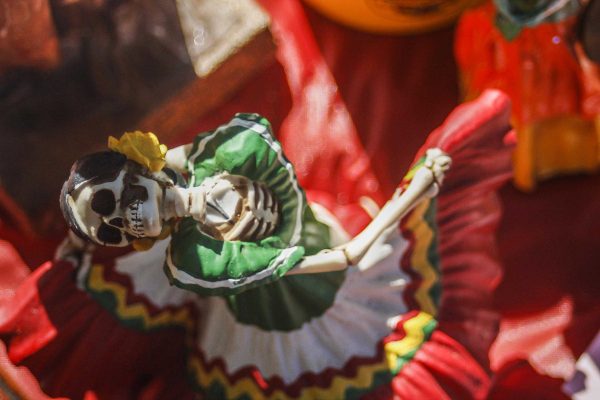Day of the Dead altars are often decorated with sugar skulls and small mementos of the deceased. (Angela Marie Samora/The Telescope)