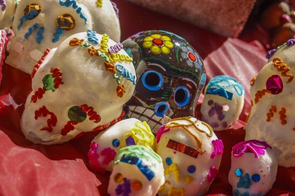 Day of the Dead altars are often decorated with sugar skulls and small mementos of the deceased. (Angela Marie Samora/The Telescope)