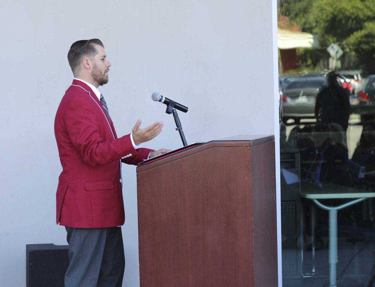 Associated Student Government President Jason Hosfield speaks at the Humanities Open House ceremony Oct. 10, 2014 outside the new building. (Photo courtesy of Deb Hellman)