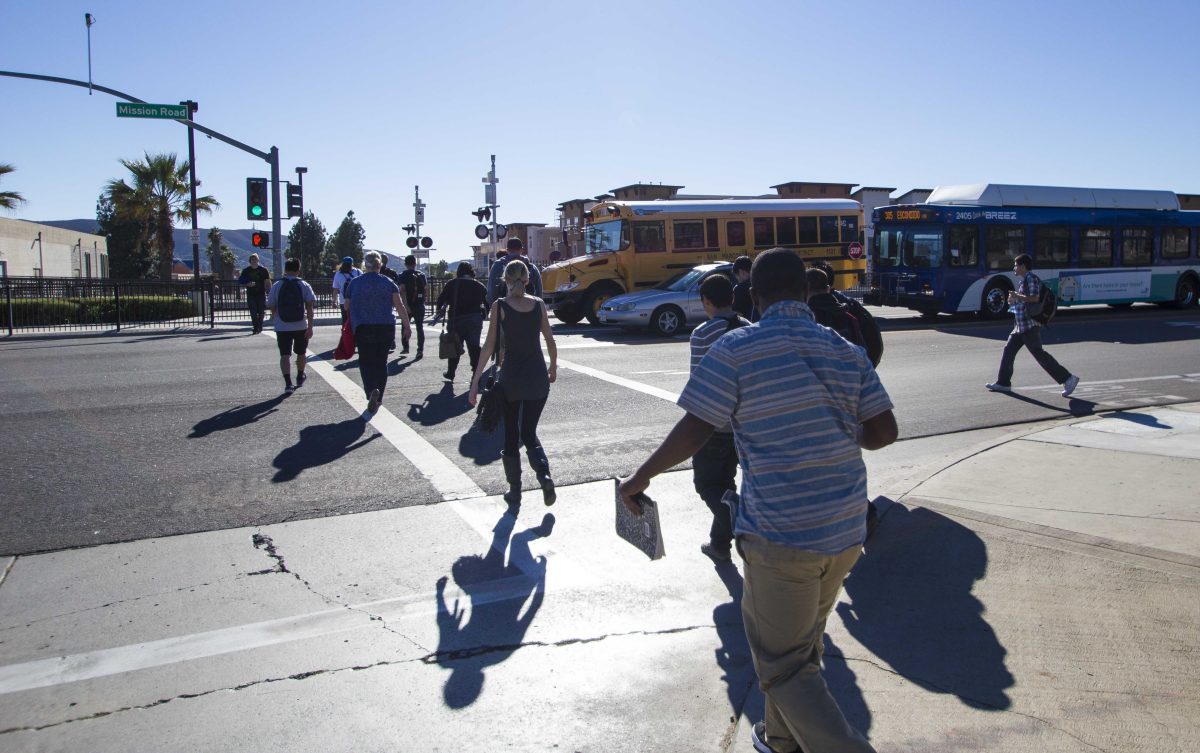 Palomar students make their way across Mission Road to the Sprinter station after class on Monday Nov. 10, 2014. (Gary West/The Telescope)