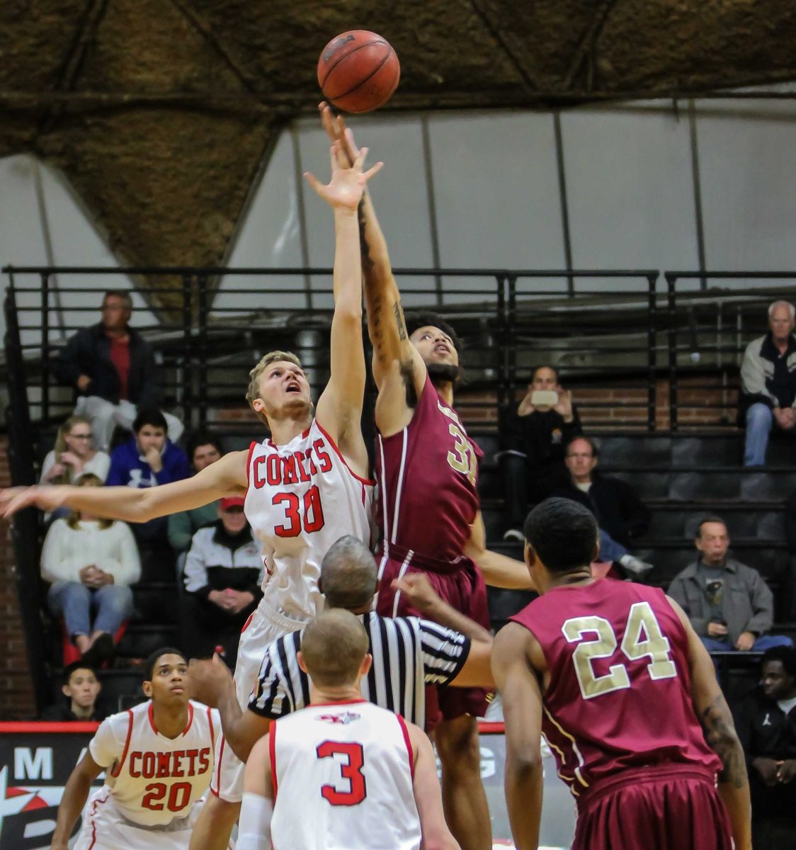 Nov. 29, 2014 | Palomar Forward (#30) Carston Nyenhuis comes up a little short on tip-off against Southwestern Jaguar Colleges (#31) Yobby Williams. The Jaguars beat the Comets 52-50 Saturday night at the Dome during Palomar's 10th annual Thanksgiving Tournament. (Philip Farry/The Telescope)