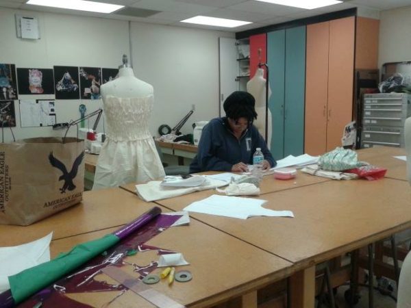 Christian Howard, 29, creates patterns for her designs during class on Nov. 14, 2014. Her collection has an "antique garden" theme. (Hayley Ulle/The Telescope)