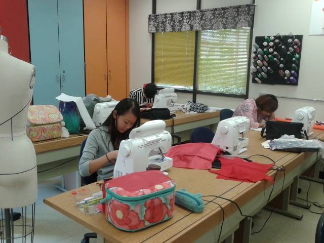 Students work on their designs at sewing machines during class on Nov. 14, 2014. (Hayley Ulle/The Telescope)