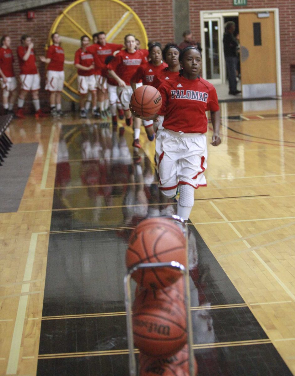 Jan. 9, 2015: Palomar Guard Lee Lee Tomlinson leads the Comets on to the court for warmups before start of the game against Mount San Jacinto at The Dome. (Stephen Davis/The Telescope)