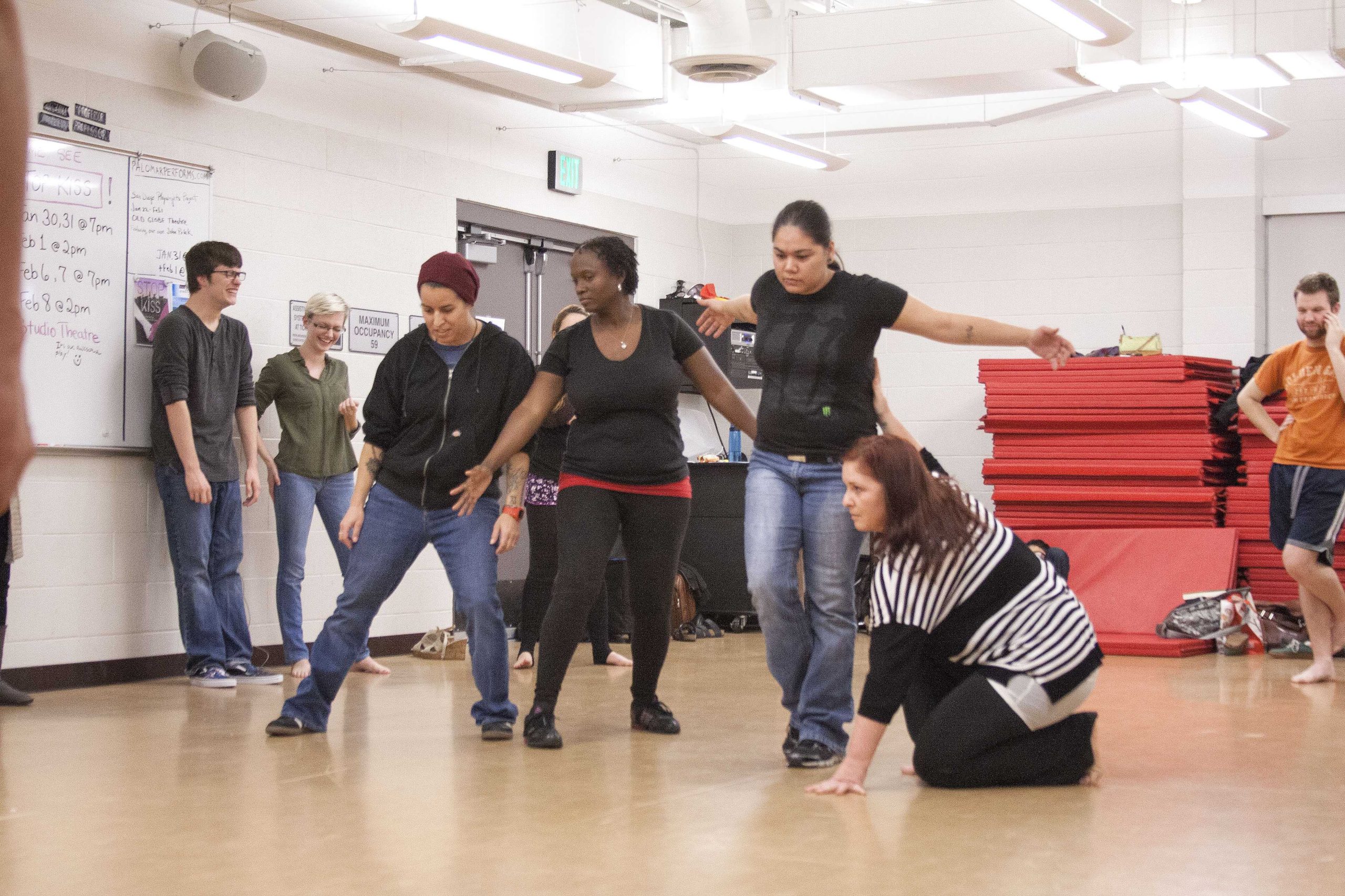 V.H. Fiore, Monique Barbour, Anna Tower, and Darcie McClain, members of the exploratory group, take part in a group exercise as part of the auditioning process for The Water Speaks on Feb. 4, 2015. (Claudia Rodriguez/The Telescope)