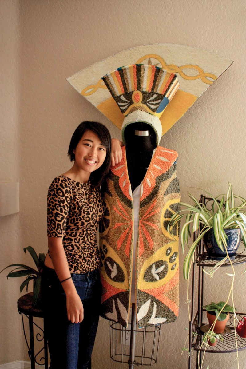 Fashion designer Jaqueline Banting poses next to her current work made of lentils, rice and crushed corn for Exhibit Ambush. (Photo courtesy of Zynada Aurelio)