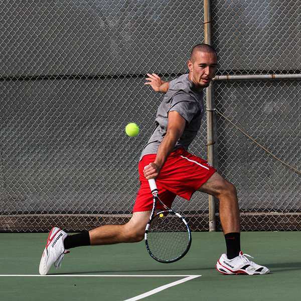 Palomar tennis player Evan Davis won his singles match against Palomar's guest San Diego City College on Feb 19, 2015. (Dirk Callum/The Telescope)