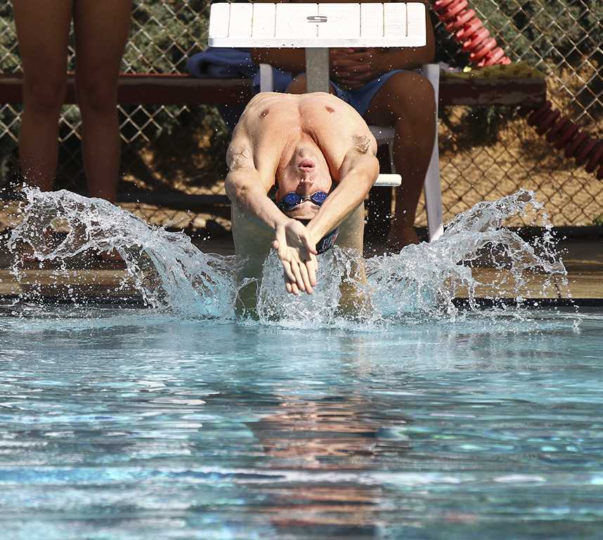 Palomar swimmer Danny Houston competes in the 100M backstroke held at Friday afternoon March 13, 2015 at the Wallace Memorial Pool. The Comets sweep visiting Southwestern College, The men’s team won 172-86 and the Women’s team won 128-82. (Philip Farry/The Telescope)