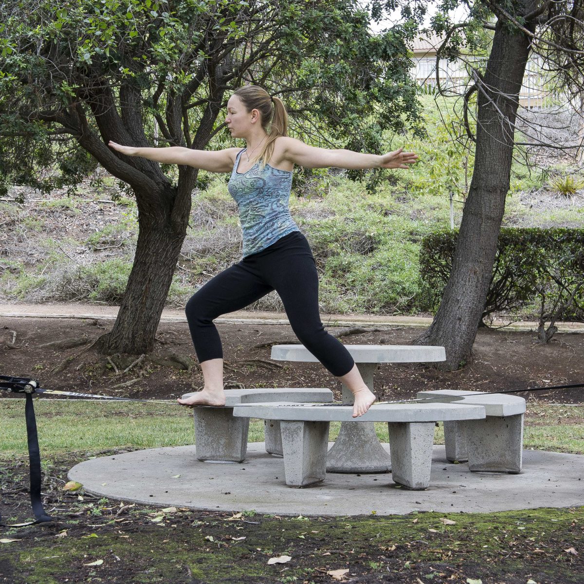 The Telescope Editor-in-Chief demonstrates the slackline yoga pose. (Amber Rosario/The Telescope)