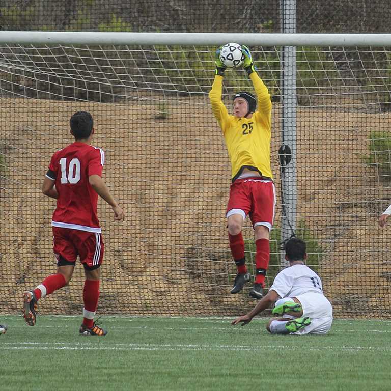 Palomar goalie Autry Hailey (25) makes a save during the first half against visiting Moorpark College Sept. 1, 2015 at Minkoff Field. The Comets defeated the Raiders 3-0 to earn their first win of the season. (Philip Farry/The Telescope)