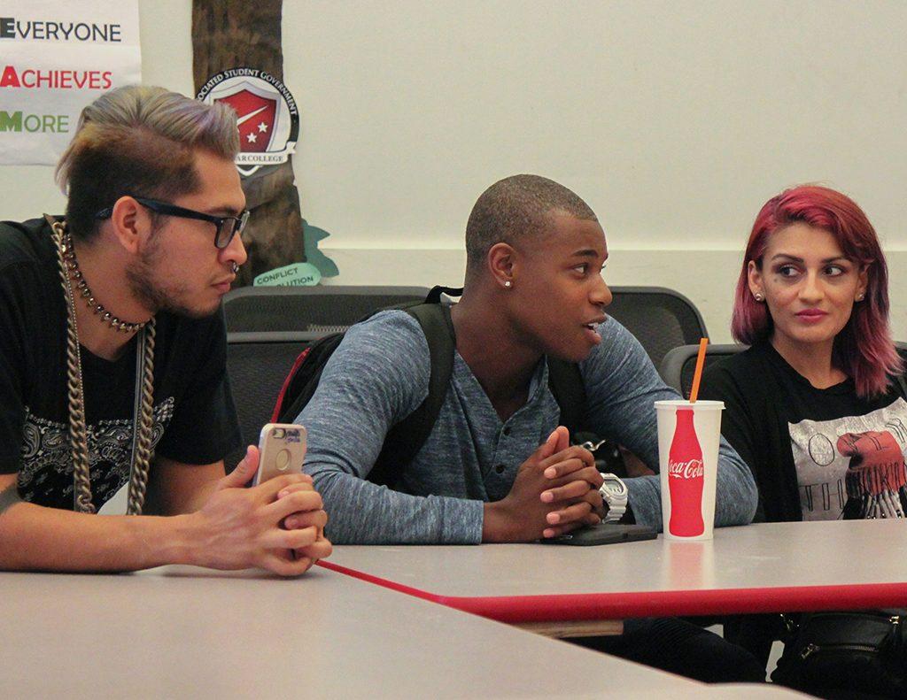 Dean Morgon discusses issues at the LGBTQA Club meeting with Daniel Arzola (R) and Rachelle Chavez (L) listening intently. Sept. 21, 2015. (Lou RoubitchekThe Telescope)