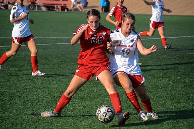 Towards the end of the second period in an attempt to tie it up Palomar Grace Busby (22) battles the defender to score a goal. Palomar lost to the visiting Santa Ana College 0-1 on Sept. 8, 2015. (Seth Jones/The Telescope)