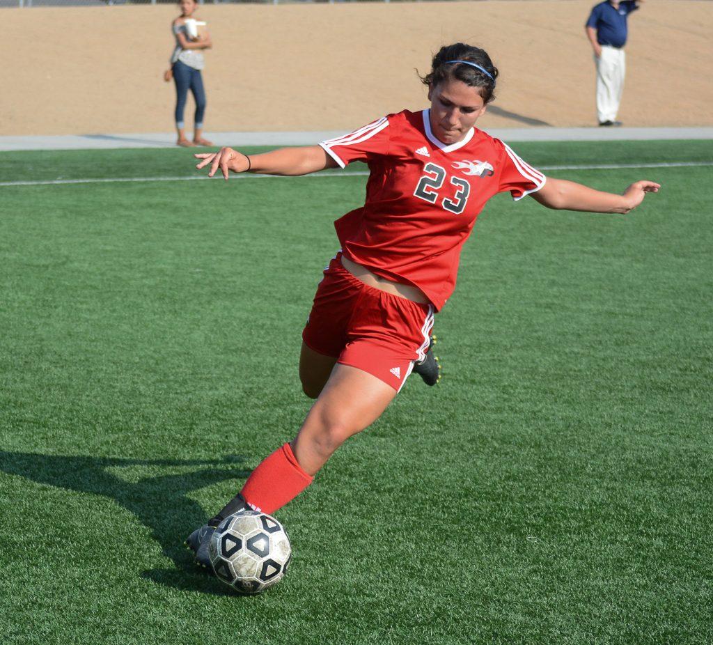 #23 Samanatha Swanson stretches to keep the ball in bounds against Santa Ana College on Sept. 8, 2015. (Seth Jones/The Telescope)