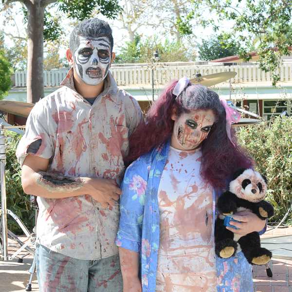 Eric Noriega and Larisa Sagarnaga, as the Walking Dead, won best group costume in the Costume Contest during Halloween Escape in the Student Union on Thursday, Oct. 29, 2015. (Yvette Monteleone/The Telescope)