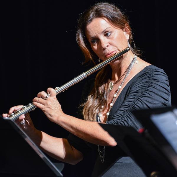 Cathy Blickenstaff joins in for a warm-up session prior to concert start for the quartet, Flutes de Salon at the Howard Brubeck Theatre, Palomar College in a quartet, Flutes de Salon on Oct. 29, 2015. Blickenstaff currently performs with the La Jolla Symphony Orchestra and is an instrumental editor for the Neil A. Kjos Music Publishing Company. (Brandy Sebastian/The Telescope)